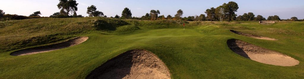Nairn Dunbar Golf Green surrounded by sand bunkers
