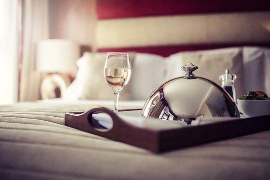 Room service tray on hotel bed