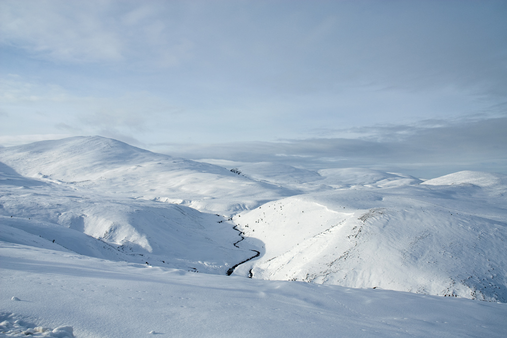 Snow-covered Cairngorm Mountains in Scotland