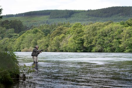 Man from Alba Fishing fishing for Salmon on the River Ness - close to Ness Walk Hotel