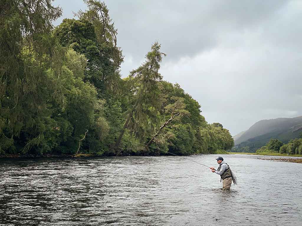 Man from Alba Fishing fishing for Trout on the River Ness 