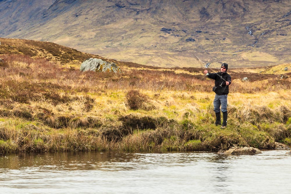 Man fly fishing in Scottish Highlands
