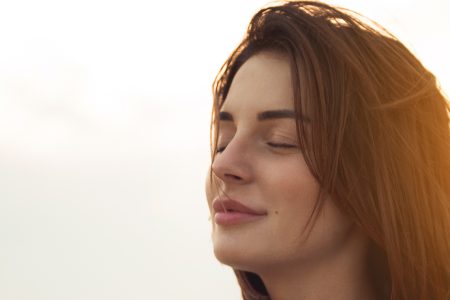 Woman with eyes closed feeling calm