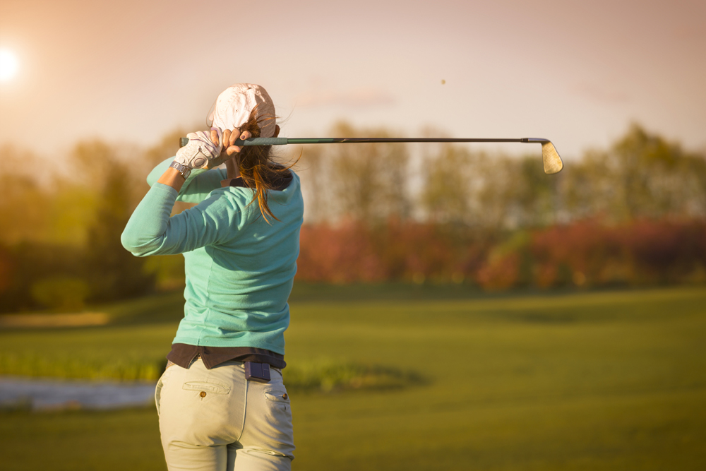 Woman playing golf