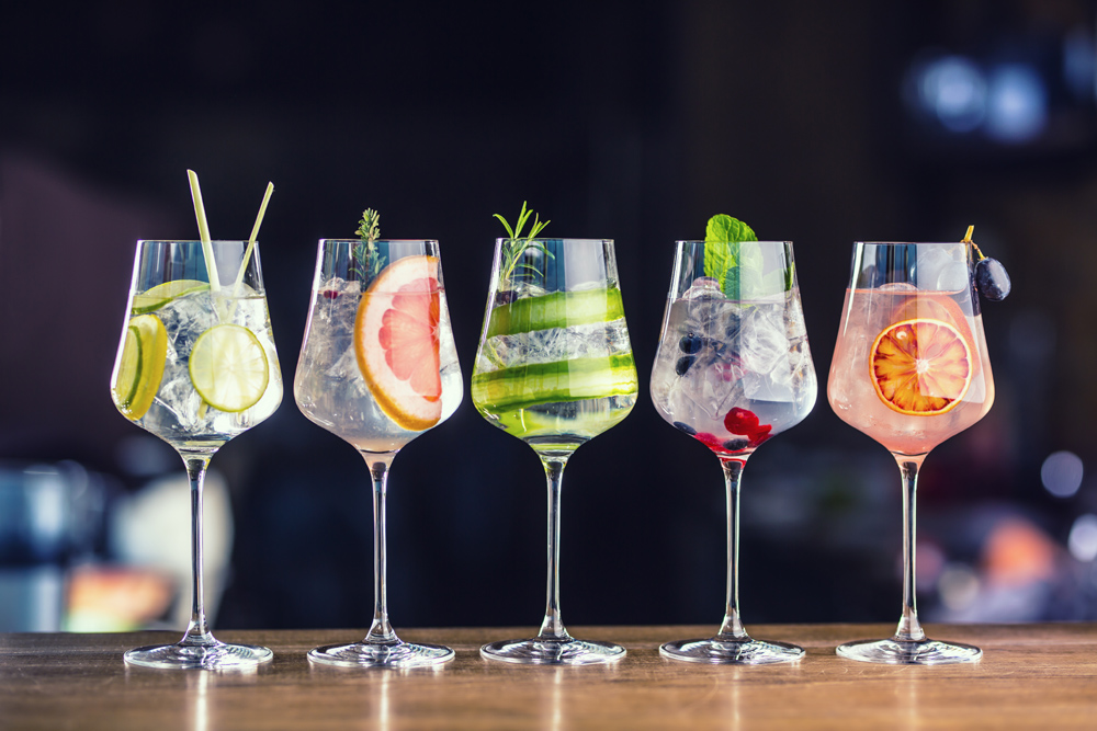 Five flavoured gins on a bar top