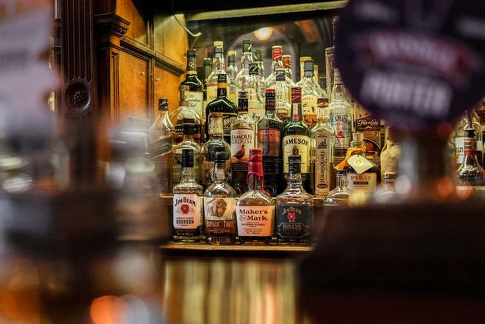 Bottles of whisky behind a bar