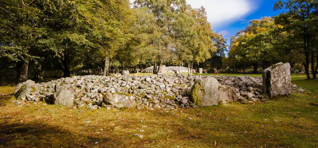 A photograph of the Clava Cairns stones during daylight.