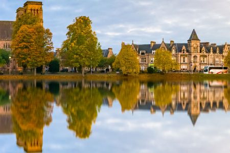 Reflections of Inverness buildings in the River Ness