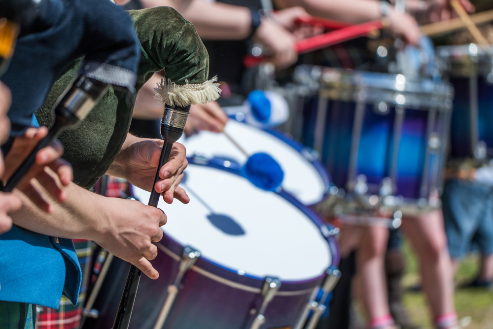 Traditional scottish pipe band in kilt at Highland Games