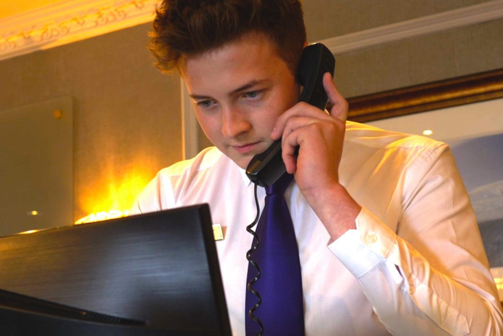 Staff member on telephone at the Kingsmills Hotel