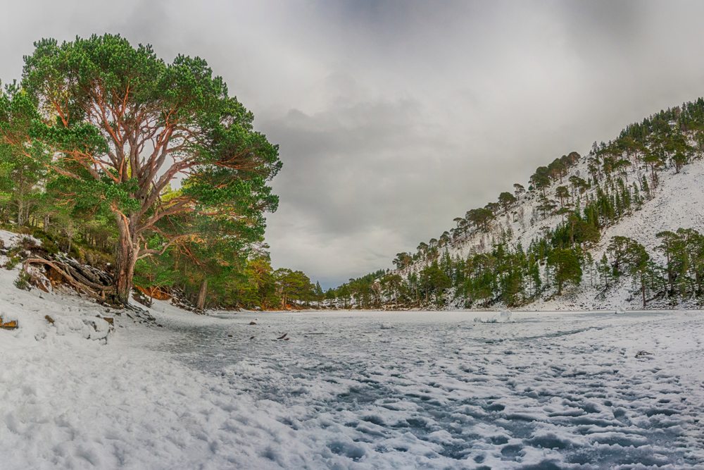An Lochan Uaine, The Green Loch frozen over in winter and dusted with snow