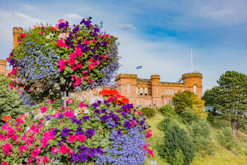 Inverness Castle with blooming spring flowers