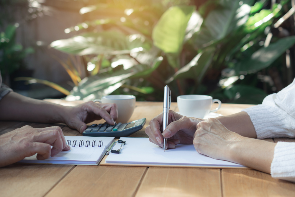 Business meeting taking place outdoors