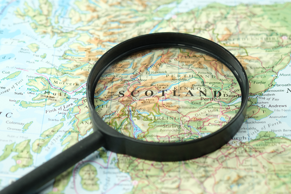 A map of Scotland with a magnifying glass