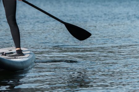 Woman on a paddle board on the water