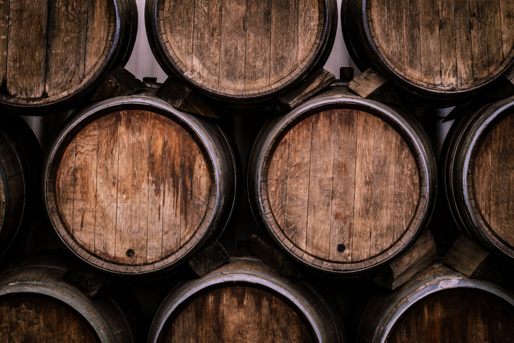 Whisky barrels stacked in a distillery