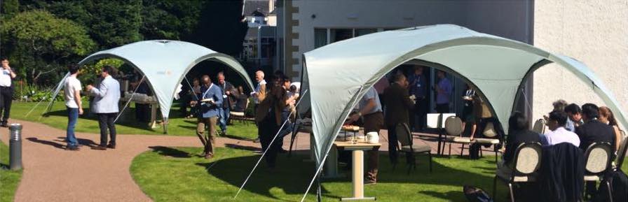 Delegates enjoying a coffee break in the gardens of the Kingsmills