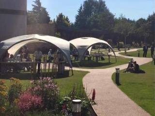 Delegates enjoying a coffee break in the gardens of the Kingsmills