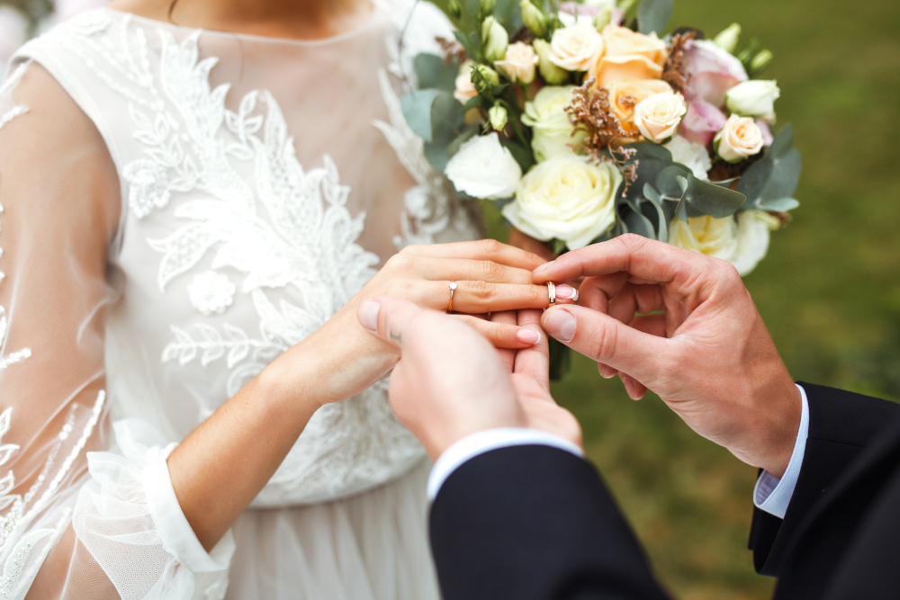 A wedding couple exchanging rings