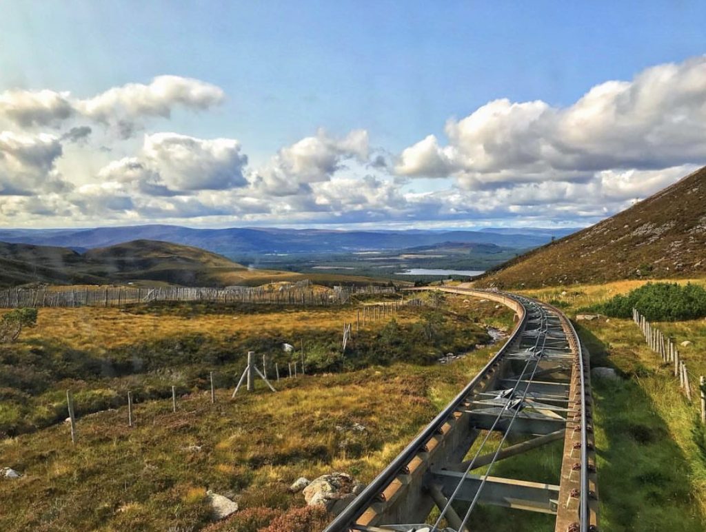Cairngorm funicular railway heading up the Cairngorm Mountains with clear train lines