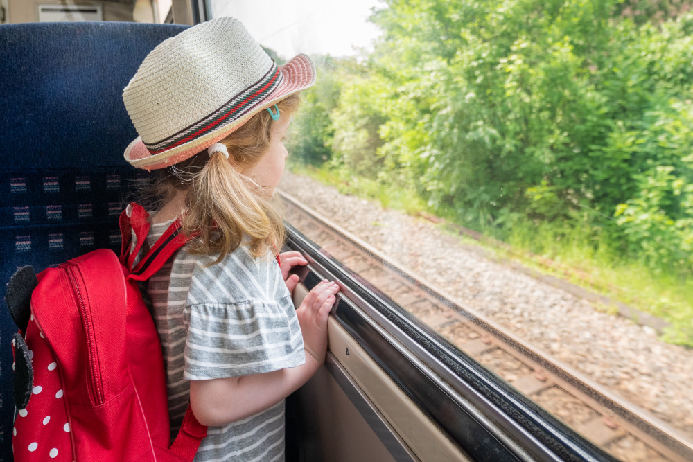 Child on a train journey in the UK