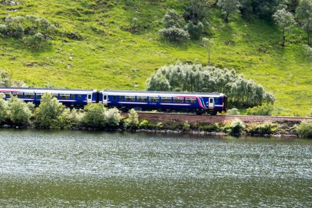 A train travelling through the Scottish Highlands