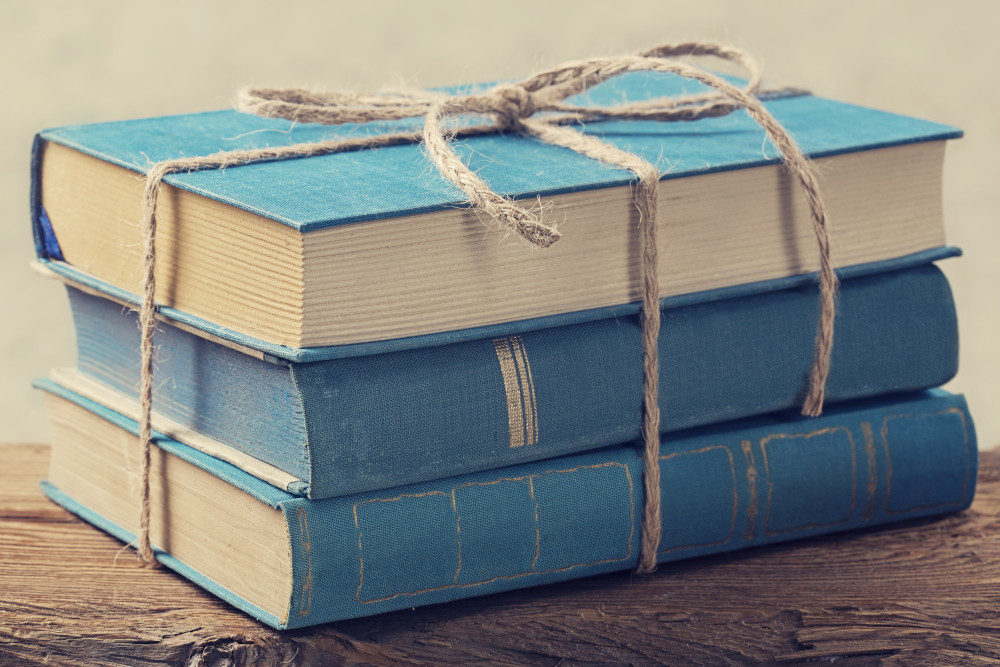 Blue books tied up with string.