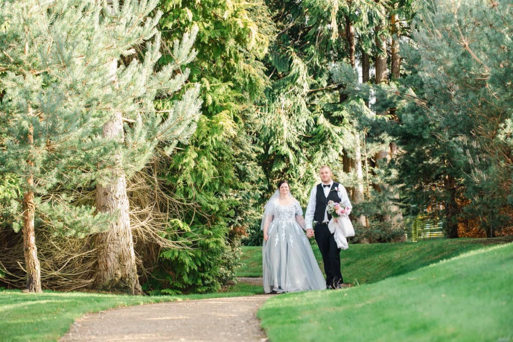 Chloe & Adam walking in the gardens on wedding day from @karenthorburnphotography