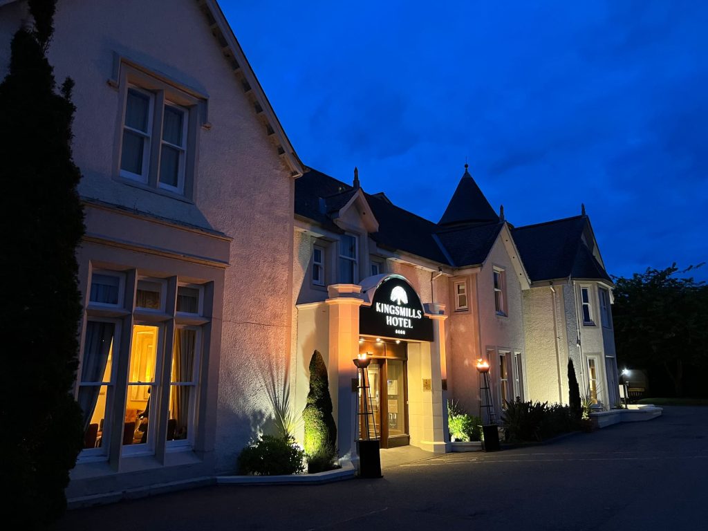 Kingsmills Hotel at night with flame towers for an event