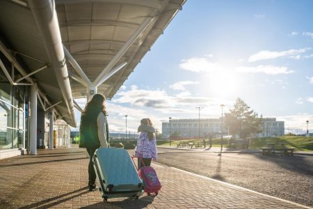 Family walking into Inverness airport