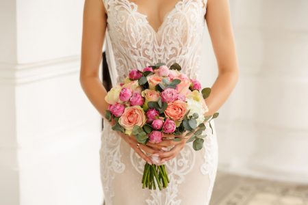 Elegant bride with colourful bouquet