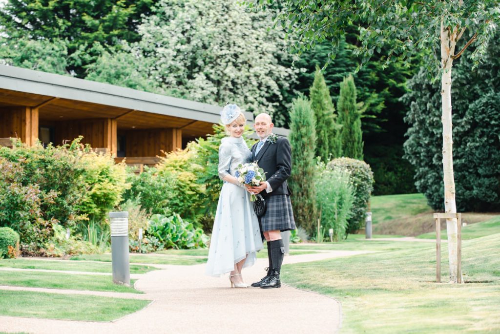 Couple in gardens on wedding day - credit Karen Thorburn