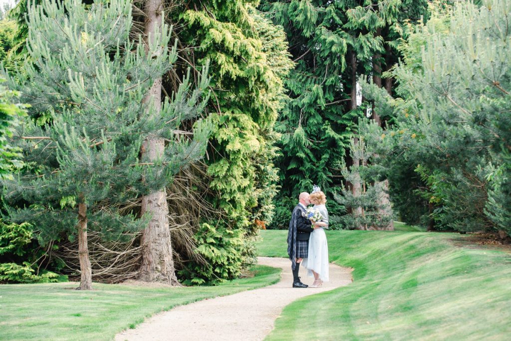 Couple in gardens on wedding day - credit Karen Thorburn