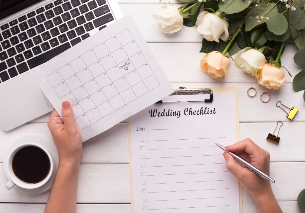 Wedding planning checklist and computer