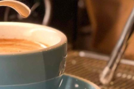 Coffee being poured at barista machine in Kingsmills Hotel into a blue cup