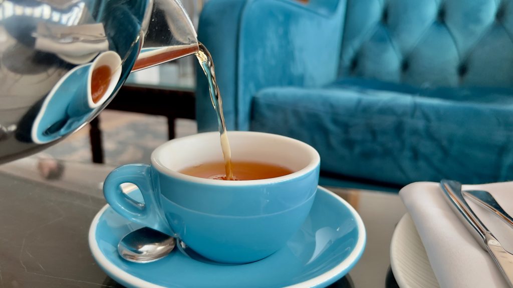 tea being poured into a blue cup in the Kingsmills Lounge