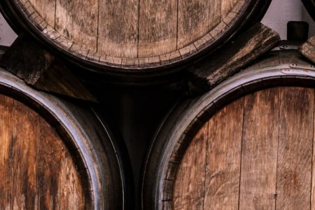 Whisky barrels stacked up at a distillery