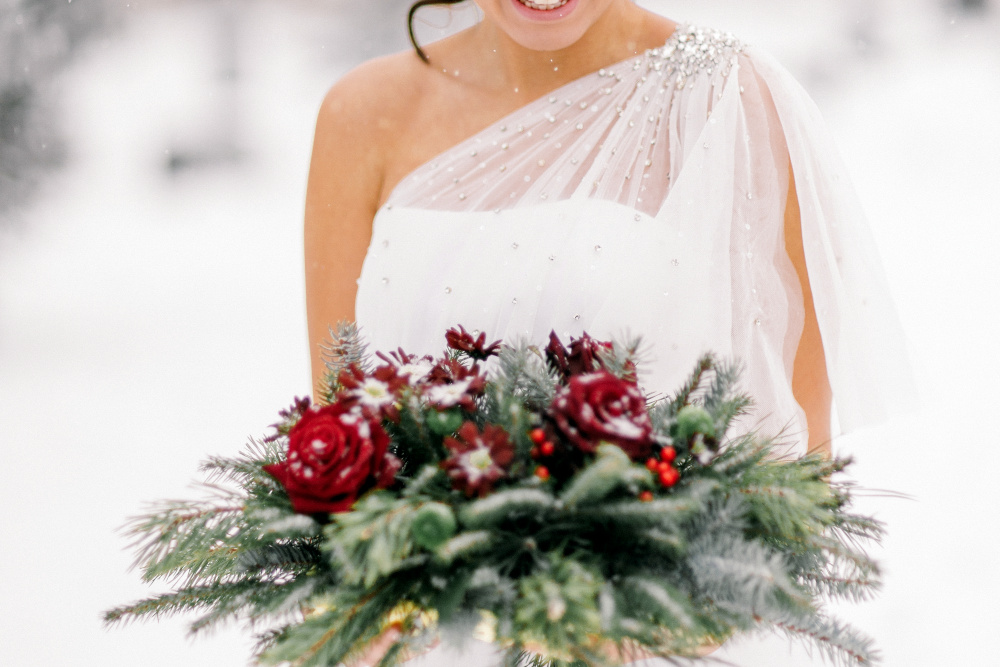 Wedding bouquet against a snowy backdrop
