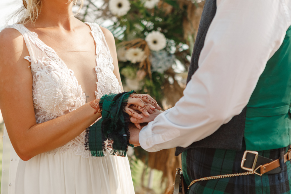 Hand fasting at a Scottish wedding