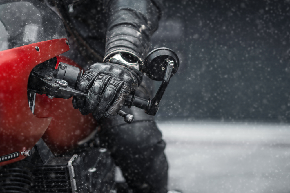 Close up of gloved hand on motorbike