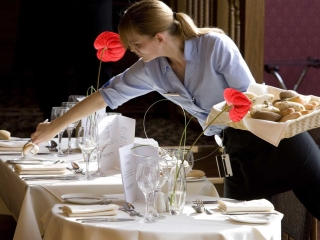 A waitress setting a table in the <a href="https://www.kingsmillshotel.com/dining/conservatory-restaurant/">Conservatory Restaurant</a> A waitress setting a table in the <a href="https://www.kingsmillshotel.com/dining/conservatory-restaurant/">Conservatory Restaurant</a>