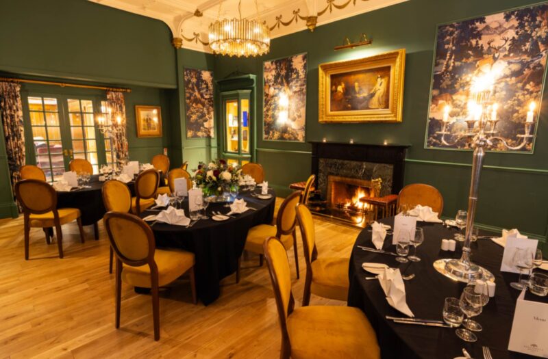 Dinner setting on oval tables for dining.