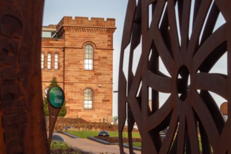 View of Inverness Castle through art installation in gardens