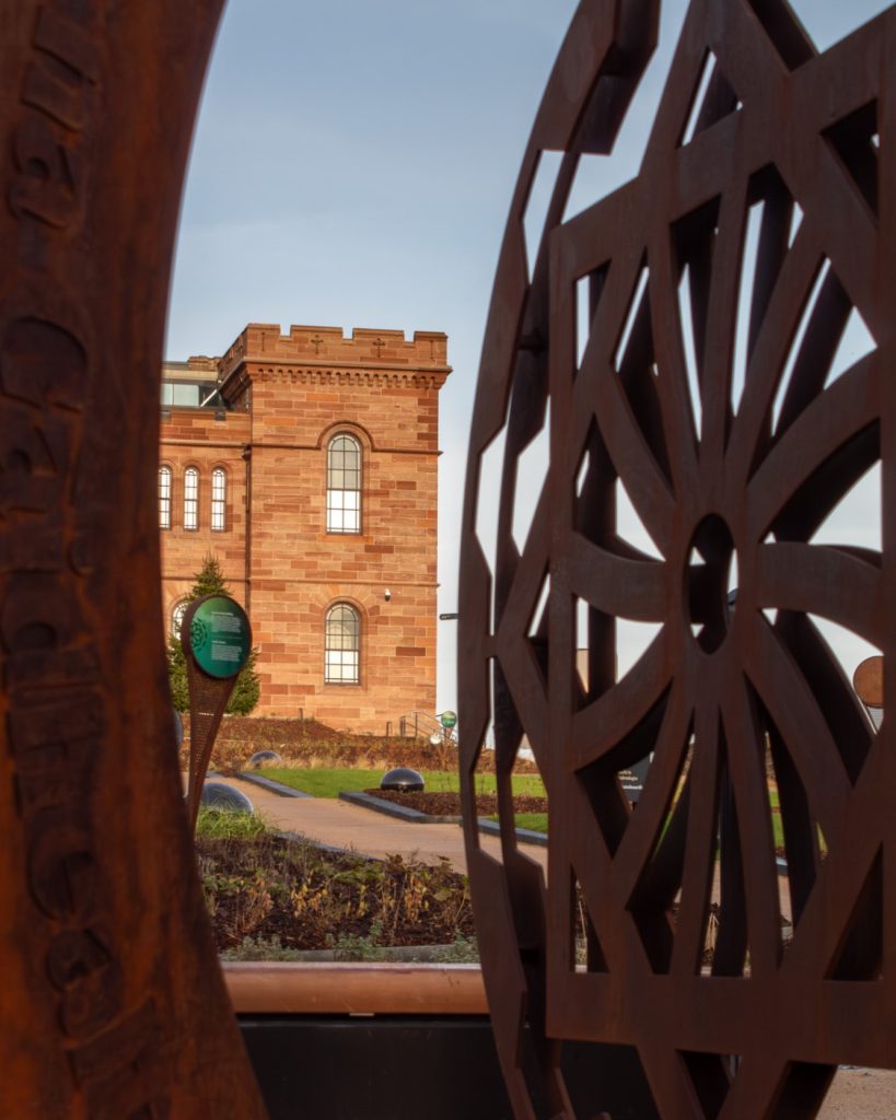 View of Inverness Castle through art installation in gardens