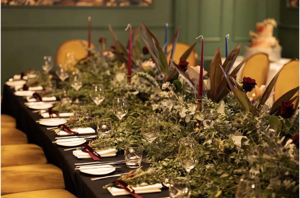 Adams Room at Kingsmills Hotel set for an intimate winter wedding with fresh flowers. Image from High and Wild Photography