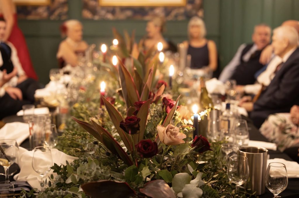 Adams Room at Kingsmills Hotel set for an intimate winter wedding with fresh flowers. Image from High and Wild Photography