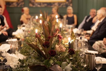 Adams Room at Kingsmills Hotel set for an intimate winter wedding with fresh flowers. Image from High and Wild Photography